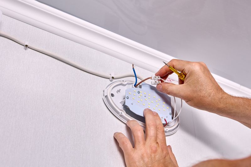 Handyman Installing Light Fixture